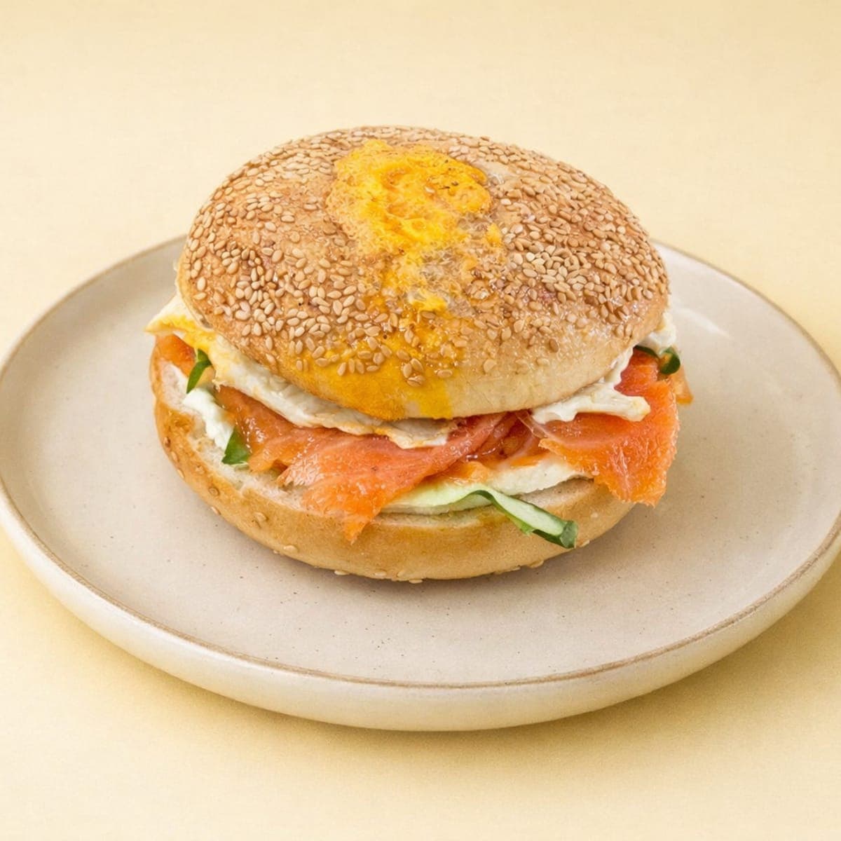 Salmon bagel with cream cheese on a stone plate